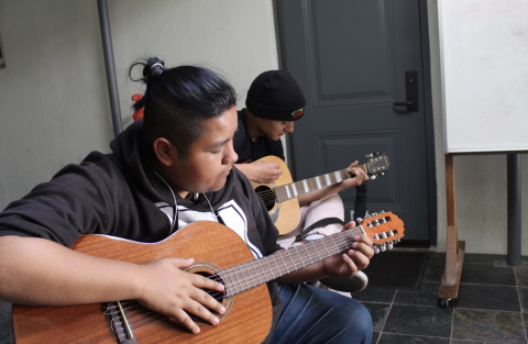 youth playing guitar